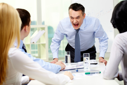 Businessman Shouting at Colleagues