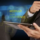 businessman hand show webinar online conference