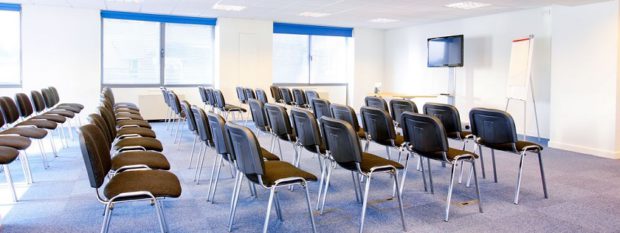 Large Presentation Room with Several Rows of Chairs
