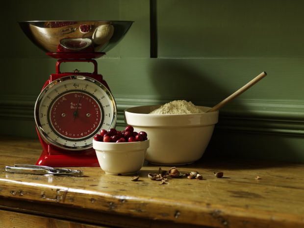 Baking Ingredients on a Table Next to Kitchen Scales