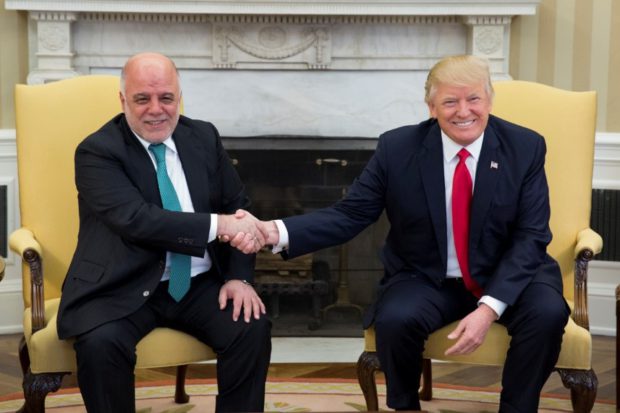 Donald Trump shaking a hands with a business man