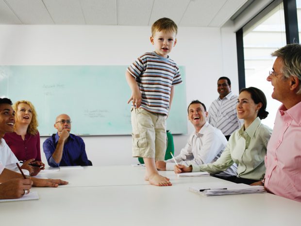 Child Walking on Table in a Meeting