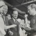 Queen Elizabeth II presenting the football world cup trophy to Bobby Moore