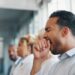 Man yawning in a meeting